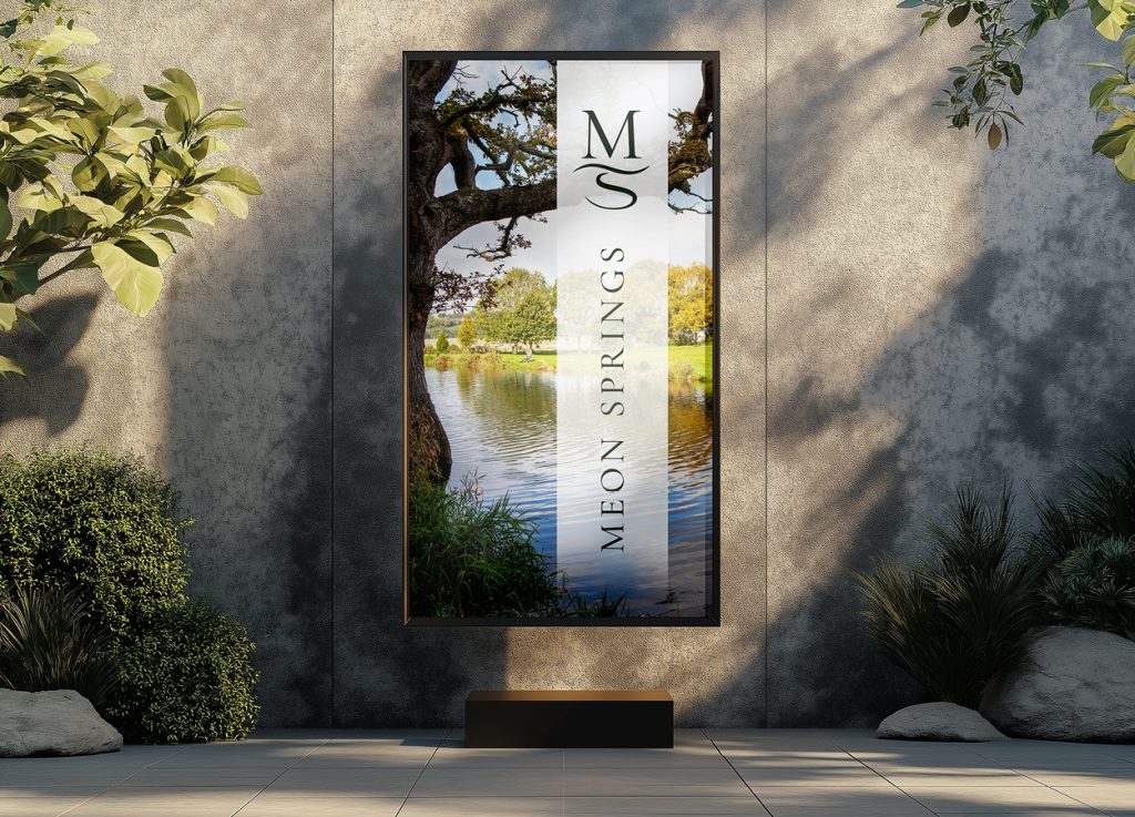 Meon Springs outdoor signage mockup featuring estate landscape photography