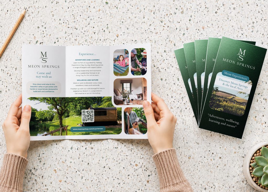 Meon Springs tri-fold brochure held open showing interior design and estate photography